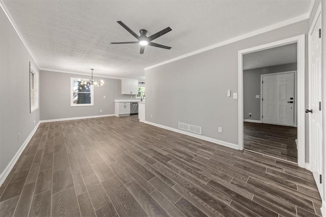 unfurnished living room featuring dark wood-type flooring, visible vents, a textured ceiling, and ceiling fan with notable chandelier
