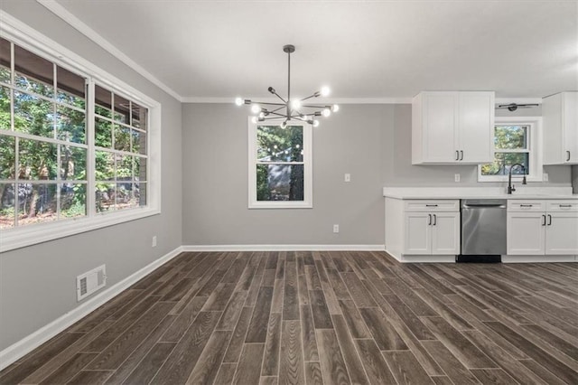kitchen with dark wood-style flooring, baseboards, light countertops, white cabinetry, and dishwasher