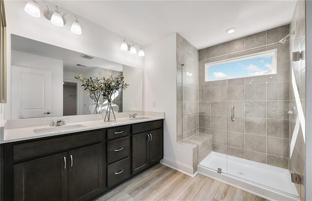 126 Jane Blvd NW, Cartersville, GA 30120 - bathroom featuring a stall shower, double vanity, wood finished floors, and baseboards