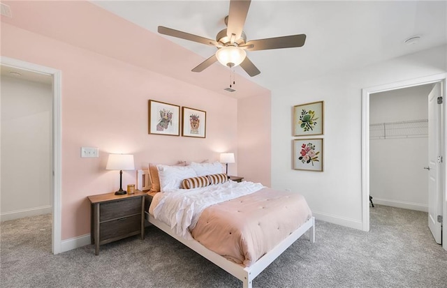 126 Jane Blvd NW, Cartersville, GA 30120 - carpeted bedroom featuring baseboards, a walk in closet, a ceiling fan, and a closet