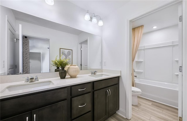 126 Jane Blvd NW, Cartersville, GA 30120 - full bath featuring double vanity, toilet, wood finished floors, and shower / tub combination