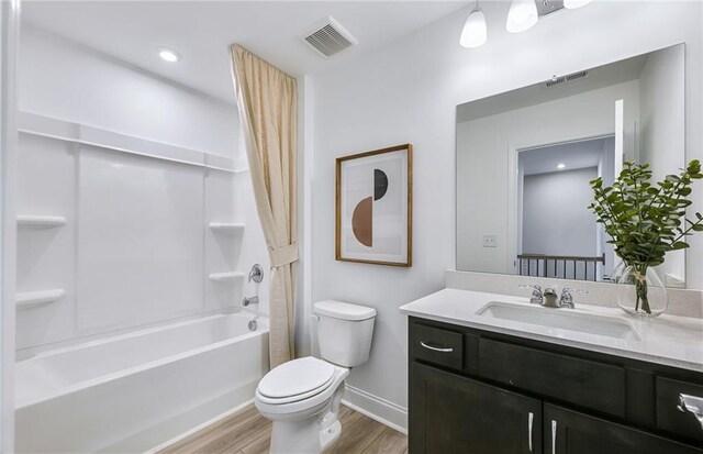 126 Jane Blvd NW, Cartersville, GA 30120 - full bathroom featuring wood finished floors, vanity, toilet, shower / bath combination with curtain, and baseboards