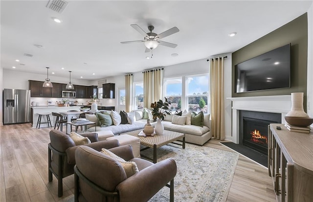 126 Jane Blvd NW, Cartersville, GA 30120 - living room featuring ceiling fan, a fireplace with flush hearth, light wood-style flooring, and recessed lighting