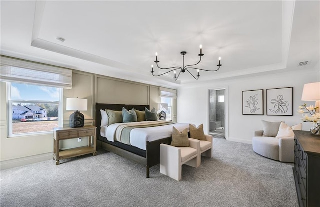 126 Jane Blvd NW, Cartersville, GA 30120 - carpeted bedroom with a tray ceiling, a chandelier, baseboards, and ensuite bathroom