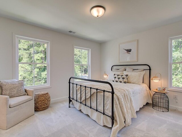 living room featuring a fireplace, light hardwood / wood-style flooring, and crown molding