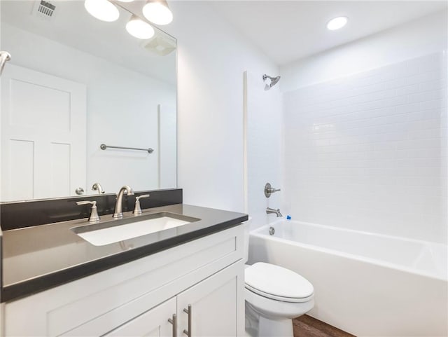 full bath featuring toilet, shower / bathtub combination, visible vents, and vanity