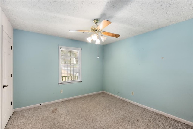 2617 Laurel Woods Ln SE, Conyers, GA 30094 - spare room featuring carpet, a ceiling fan, and a textured ceiling