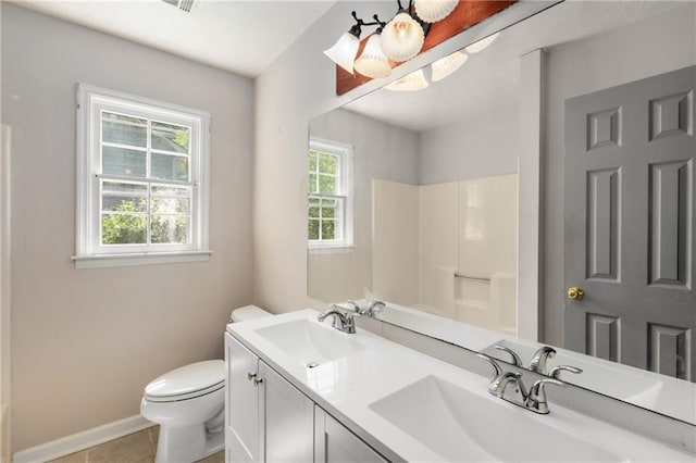 2617 Laurel Woods Ln SE, Conyers, GA 30094 - bathroom with double vanity, a shower, and tile patterned flooring