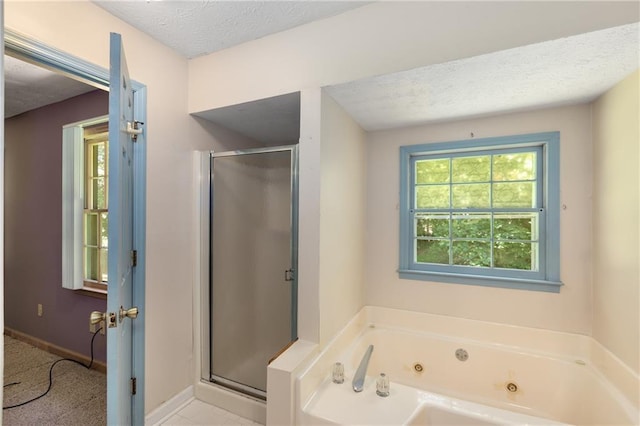 2617 Laurel Woods Ln SE, Conyers, GA 30094 - full bathroom with a shower stall, a whirlpool tub, and a textured ceiling