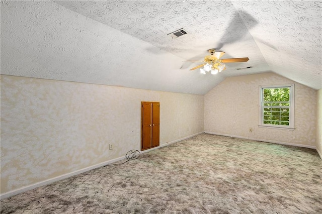 2617 Laurel Woods Ln SE, Conyers, GA 30094 - additional living space featuring a textured ceiling, lofted ceiling, carpet floors, and ceiling fan