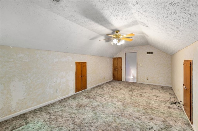 2617 Laurel Woods Ln SE, Conyers, GA 30094 - additional living space with lofted ceiling, carpet floors, a ceiling fan, and a textured ceiling