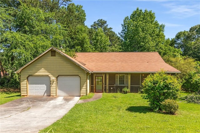 2617 Laurel Woods Ln SE, Conyers, GA 30094 - view of front of property with a front yard, an attached garage, covered porch, and concrete driveway