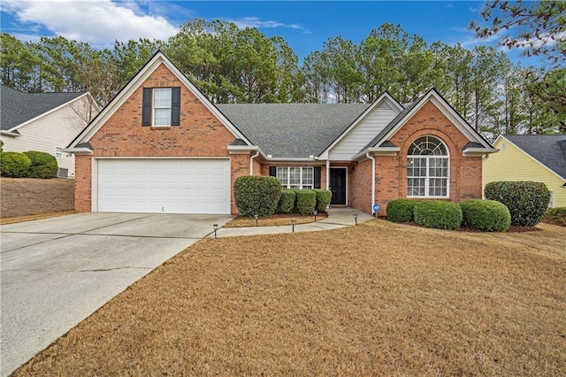 front of property featuring a garage and a front lawn