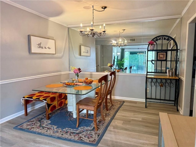 6851 Roswell Rd Unit D33, Atlanta, GA 30328 - dining space featuring a chandelier, ornamental molding, wood finished floors, and baseboards