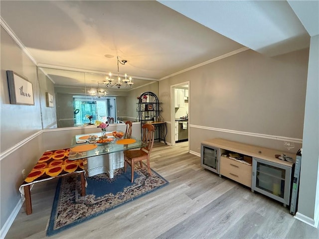 6851 Roswell Rd Unit D33, Atlanta, GA 30328 - dining space with wood finished floors, a chandelier, ornamental molding, and baseboards