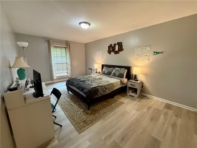 6851 Roswell Rd Unit D33, Atlanta, GA 30328 - bedroom featuring light wood-style flooring and baseboards