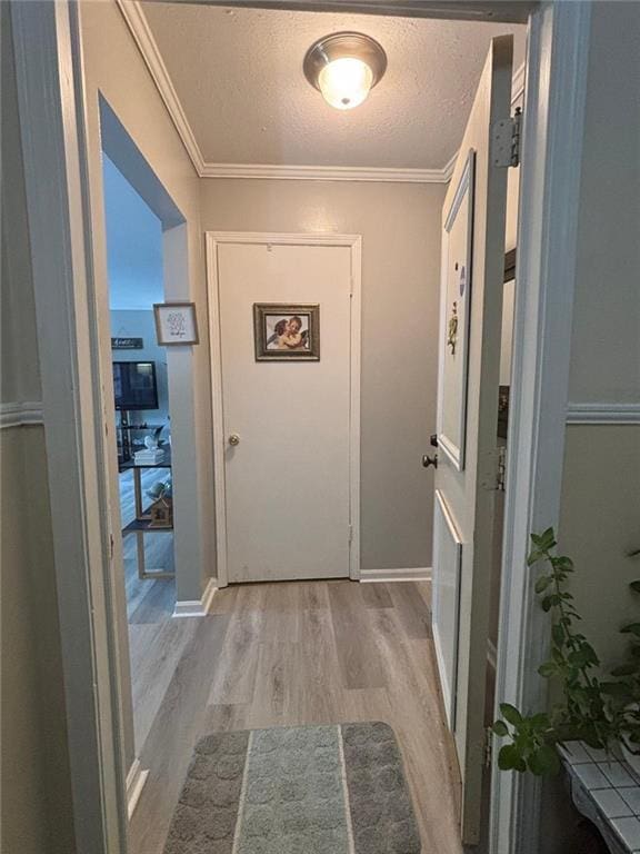 6851 Roswell Rd Unit D33, Atlanta, GA 30328 - corridor with wood finished floors, a textured ceiling, ornamental molding, and baseboards