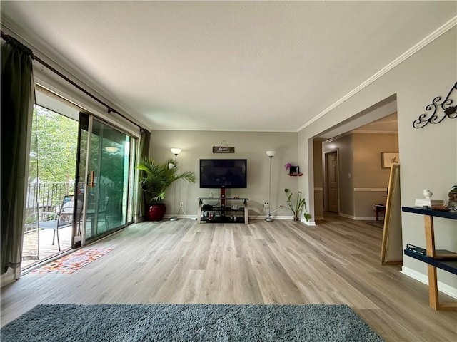 6851 Roswell Rd Unit D33, Atlanta, GA 30328 - living room with wood finished floors, baseboards, and crown molding