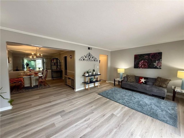 6851 Roswell Rd Unit D33, Atlanta, GA 30328 - living area with a chandelier, crown molding, wood finished floors, and baseboards