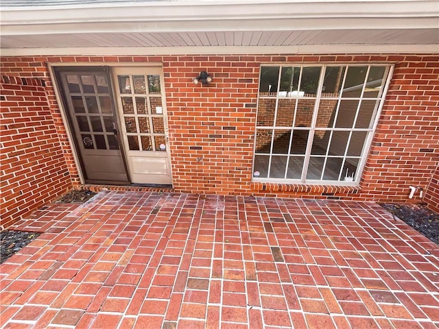 entrance to property featuring a patio