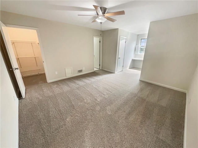 carpeted empty room with ceiling fan