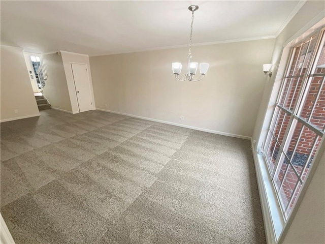 spare room featuring a notable chandelier, crown molding, and carpet flooring