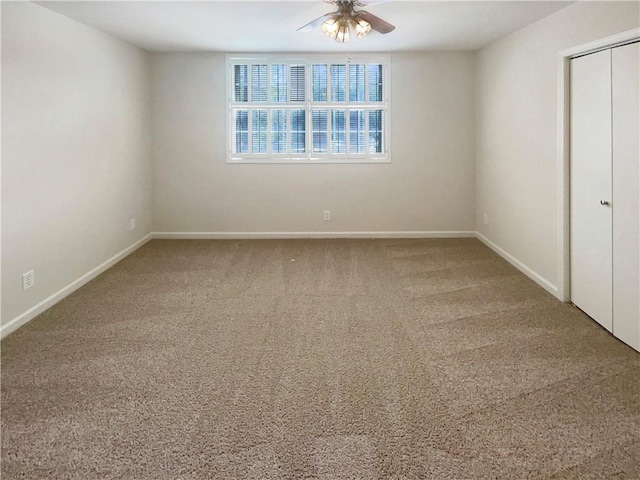 unfurnished bedroom with a closet, ceiling fan, and carpet flooring