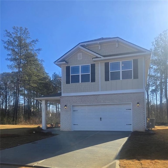 view of front of house with a garage and central AC unit