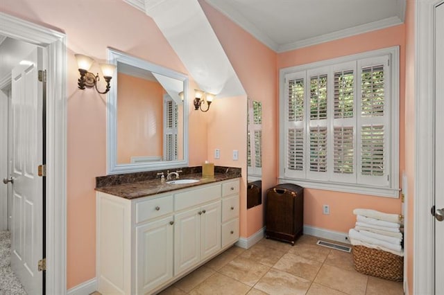 bathroom featuring vanity, tile patterned floors, and crown molding