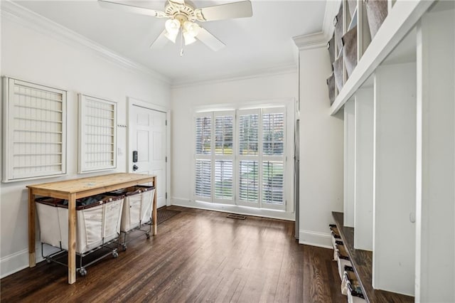 interior space featuring baseboards, dark wood-type flooring, a ceiling fan, and crown molding