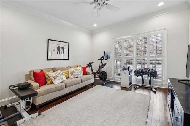 exercise area featuring baseboards, a ceiling fan, ornamental molding, dark wood-type flooring, and recessed lighting