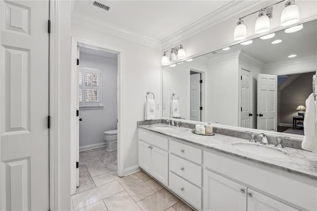 full bath featuring double vanity, visible vents, toilet, crown molding, and a sink