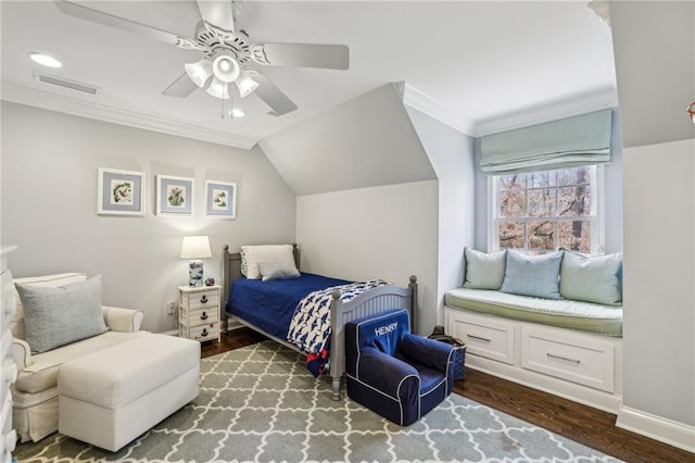 bedroom with dark wood finished floors, lofted ceiling, visible vents, ornamental molding, and ceiling fan