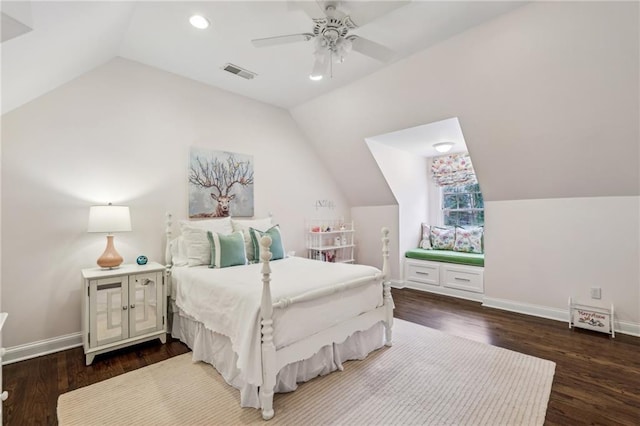 bedroom featuring lofted ceiling, baseboards, visible vents, and dark wood-type flooring