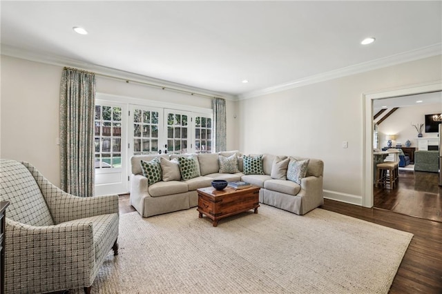 living area with french doors, crown molding, recessed lighting, wood finished floors, and baseboards