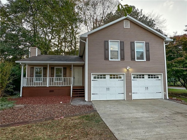 view of front of house with a porch and a garage