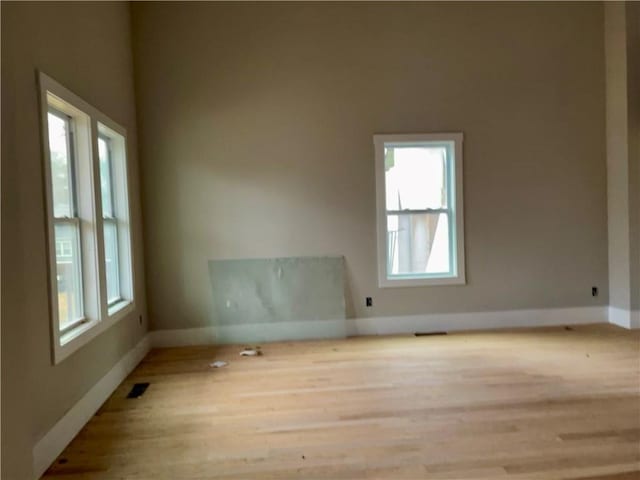 unfurnished room featuring a wealth of natural light