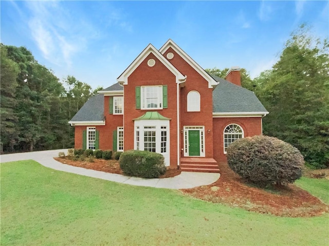 exterior space with a front lawn