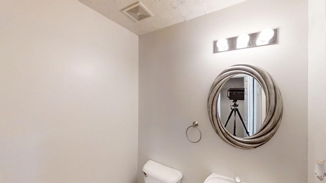 364 Springhaven Way, Lawrenceville, GA 30046 - detailed view of a textured ceiling and toilet