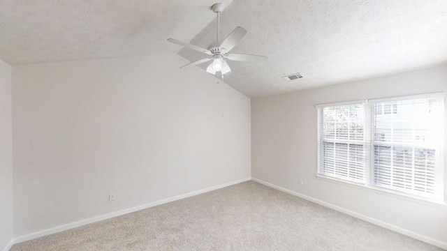364 Springhaven Way, Lawrenceville, GA 30046 - unfurnished room with a ceiling fan, light colored carpet, lofted ceiling, and a textured ceiling