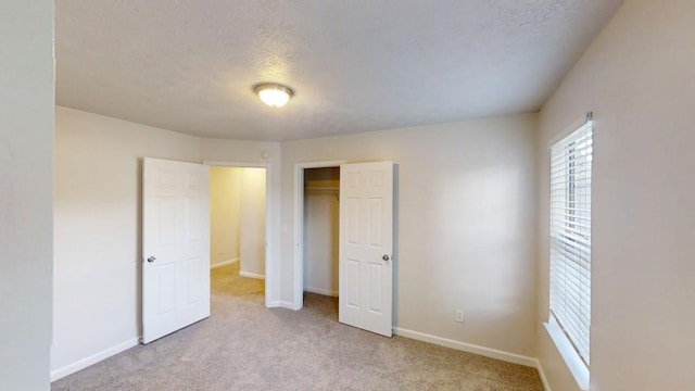 364 Springhaven Way, Lawrenceville, GA 30046 - unfurnished bedroom featuring carpet flooring, a closet, and a textured ceiling