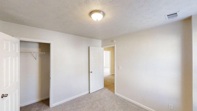 364 Springhaven Way, Lawrenceville, GA 30046 - unfurnished bedroom featuring carpet flooring, a closet, and a textured ceiling