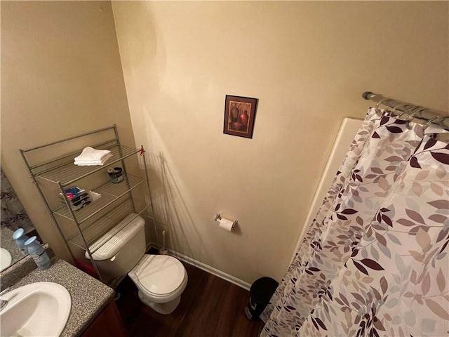 bathroom featuring hardwood / wood-style floors, vanity, and toilet