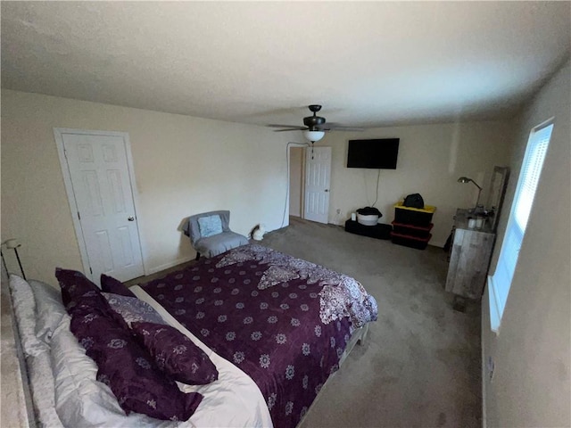 bedroom featuring ceiling fan and carpet floors