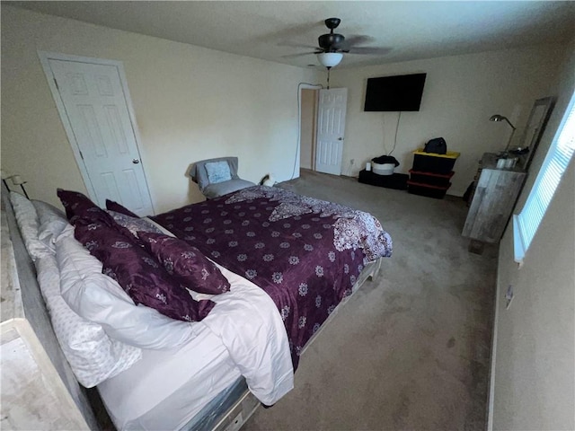 bedroom with ceiling fan and carpet floors