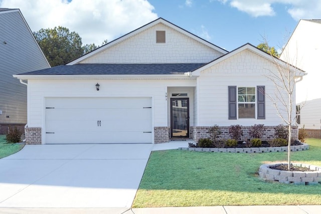 view of front facade with a garage and a front yard