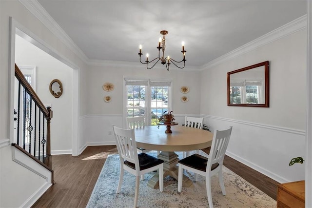 dining room with baseboards, an inviting chandelier, dark wood-style floors, and crown molding