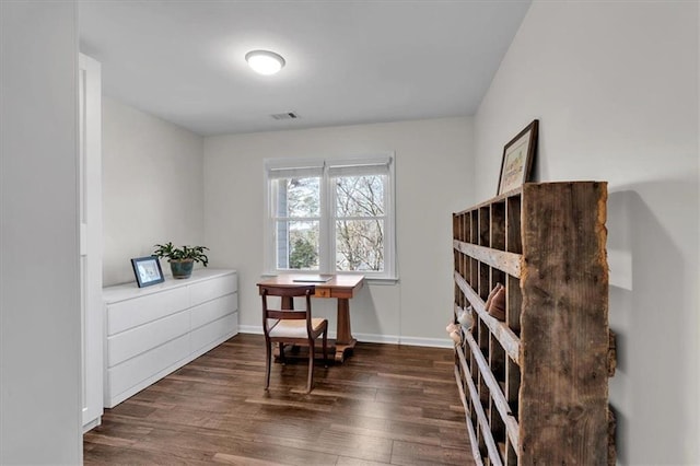 office with visible vents, baseboards, and dark wood-style floors