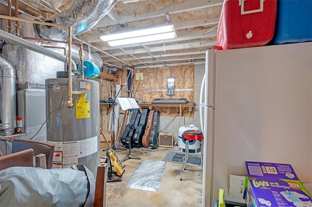 unfinished below grade area featuring water heater and freestanding refrigerator