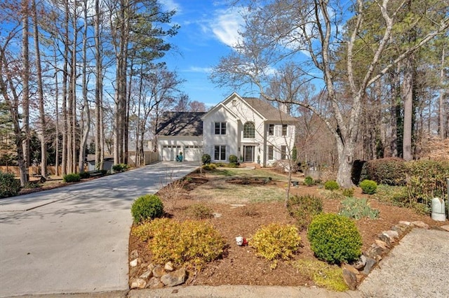 view of front of house with an attached garage and driveway